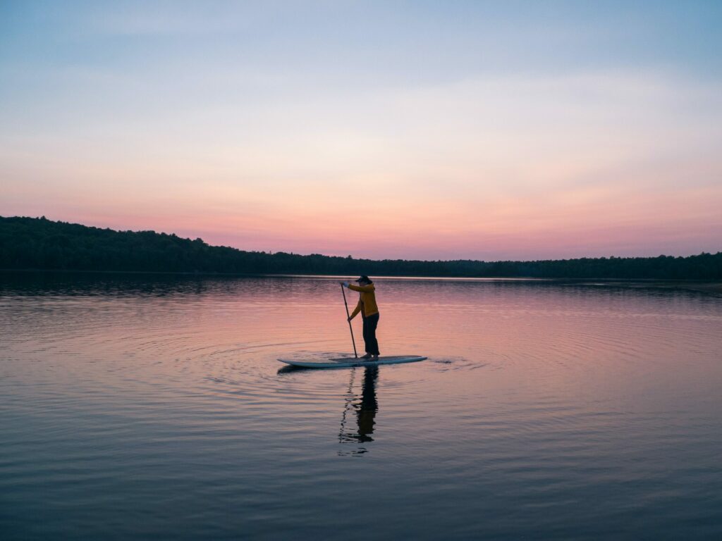 paddle boarder on lake